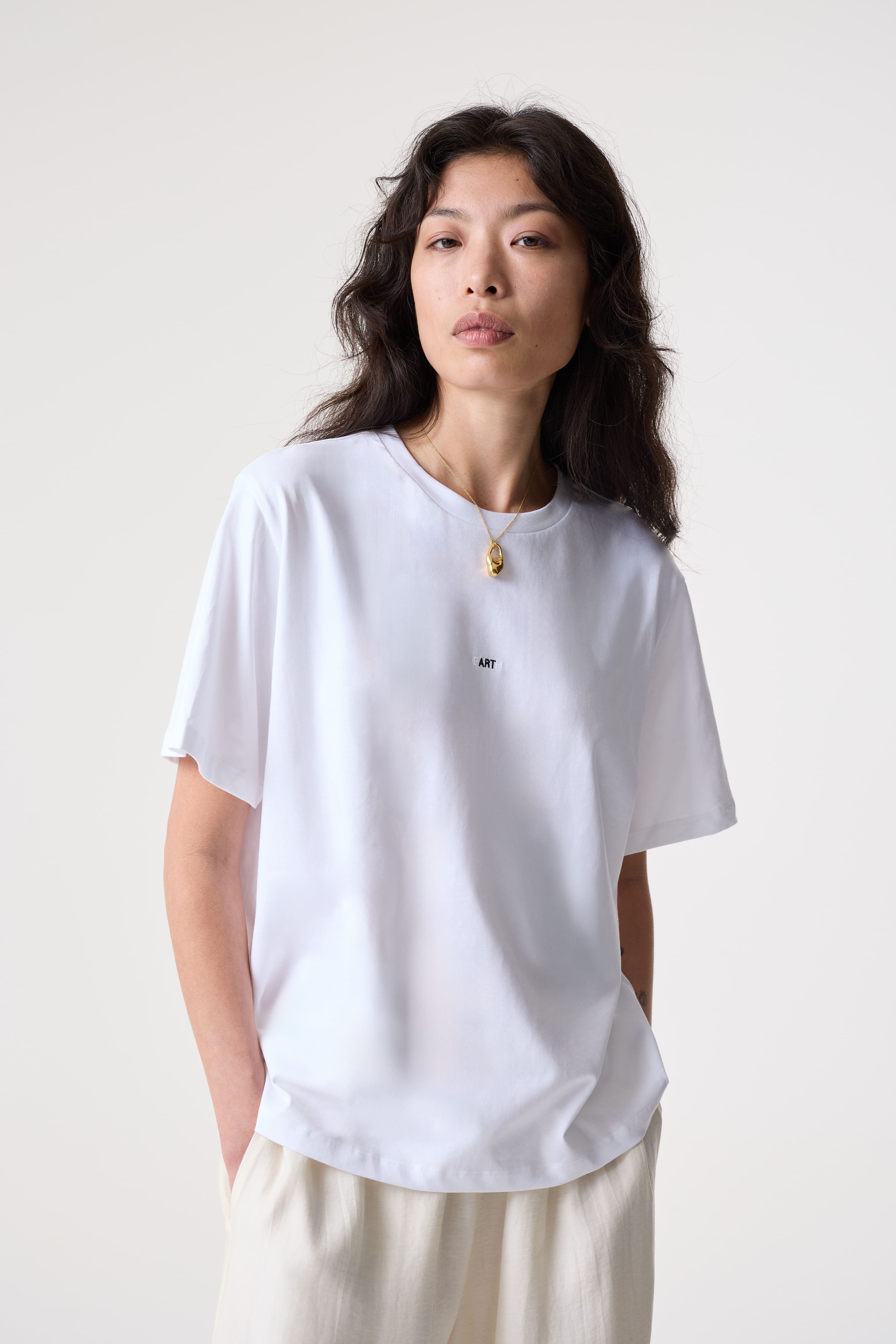 Adria 'EARTH/ART' White T-shirt | Organic Cotton Slogan Top | AKYN